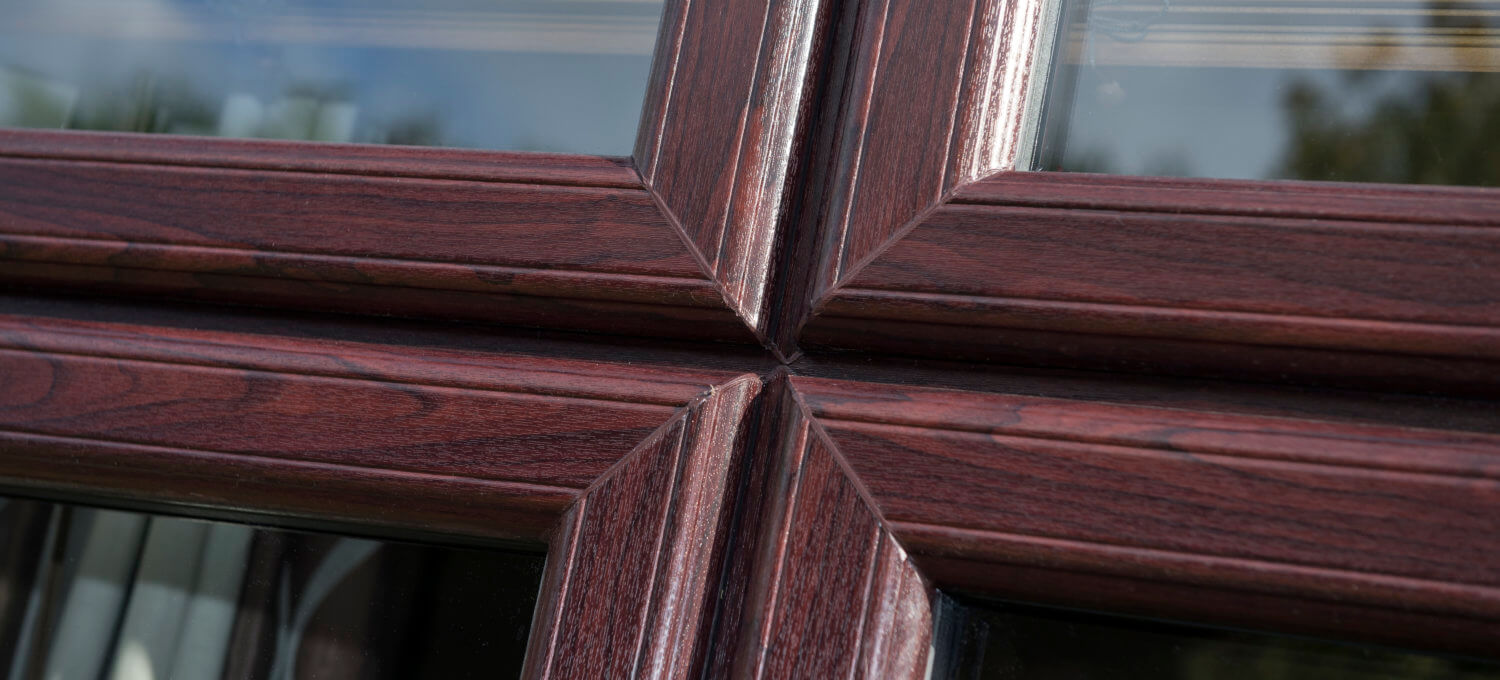 red brown sculptured sash windows corner