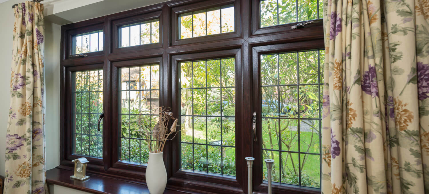 dark brown leaded sculptured sash windows