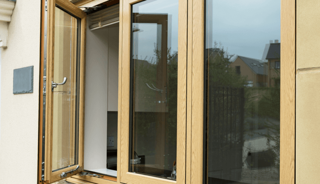 light brown woodgrain foil flush casement windows with the left window open