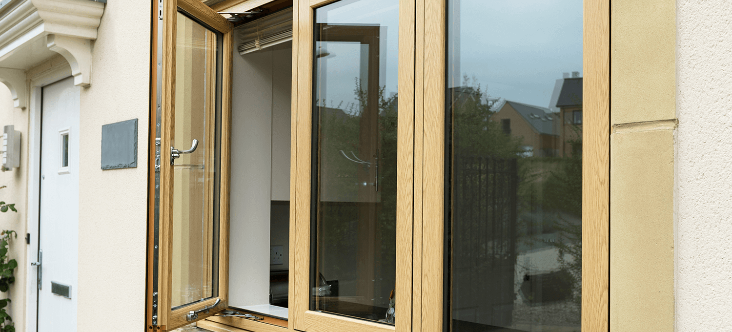 light brown woodgrain foil flush casement windows with the left window open